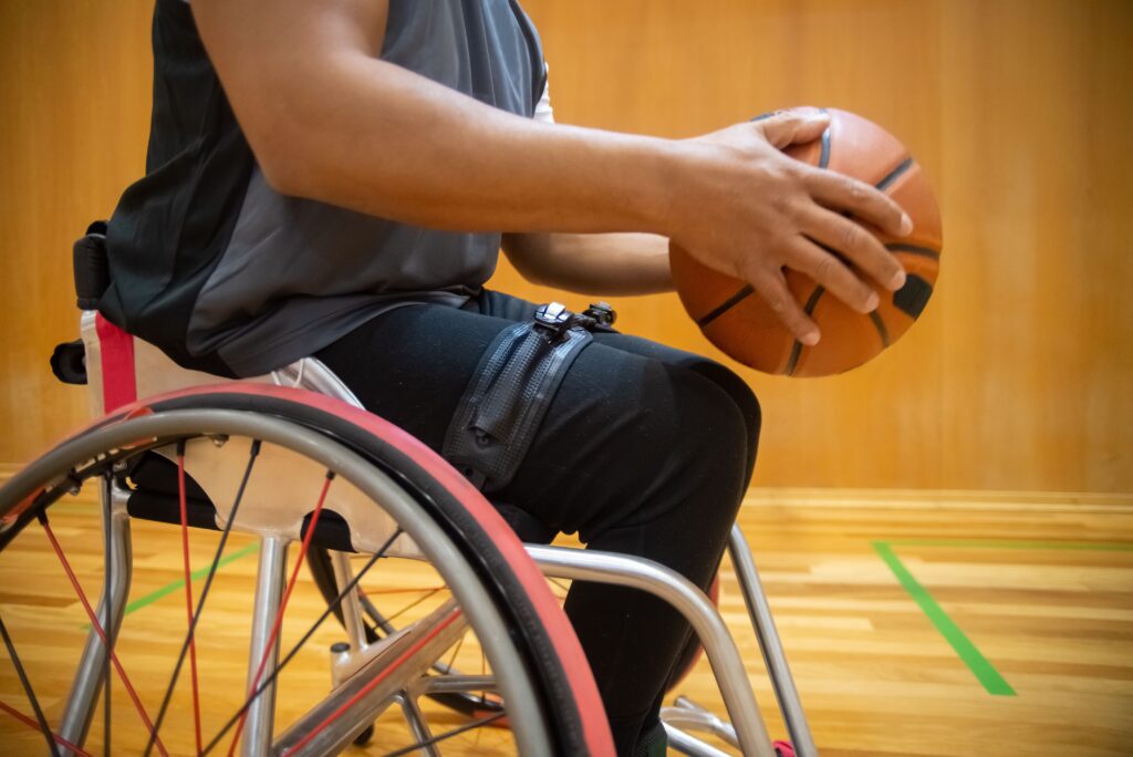 Current image: Men playing wheelchair basketball