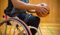 Men playing wheelchair basketball